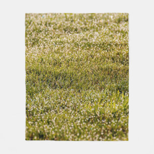 Fresh spring green grass background, with bokeh ef fleece blanket