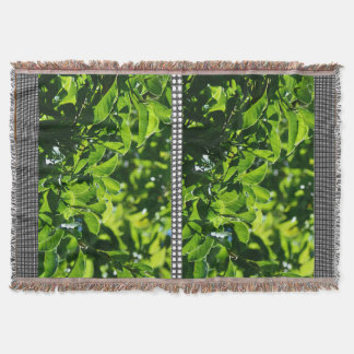 fresh spring green leaves. nature photography. throw blanket