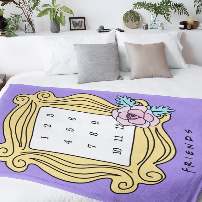 FRIENDS™ | Monthly Milestone Baby Fleece Blanket (Blanket on bed)