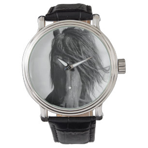 Friesian stallion in the wind. watch