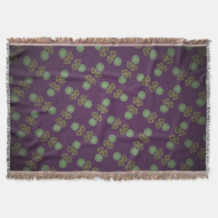 Fringe cover with flower on purple throw blanket