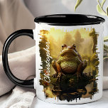 Frog by Morning Pond Reflection  Mug<br><div class="desc">Start your day with the tranquil beauty of the Frog by Morning Pond Reflection Mug. This charming mug features a delightful image of a frog perched by a serene pond, with the early morning light and forest scenery beautifully reflected in the water. Customised with your name, it adds a unique...</div>
