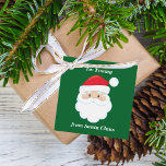 From Santa Claus Cute Custom Green Kids Christmas Favour Tags<br><div class="desc">Customise these cute Santa Claus gift tags with your own personalised text with your kids name in white script. Santa's red hat and white beard are the perfect holiday drawing on this pretty green gift tag for your presents.</div>