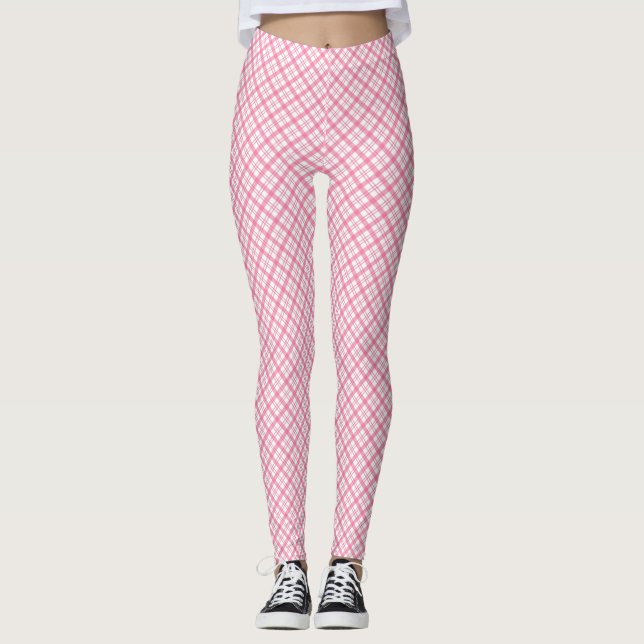 Front and back views of pink plaid leggings worn  (Front)