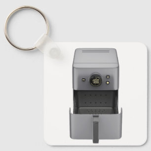 Front view of an open, empty air fryer key ring