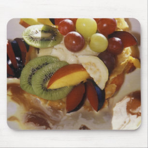 Fruit salad with ice cream. mouse pad
