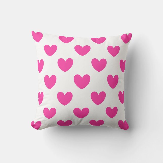Fuchsia pink polka hearts on white cushion (Front)