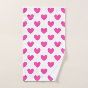 Fuchsia pink polka hearts on white hand towel