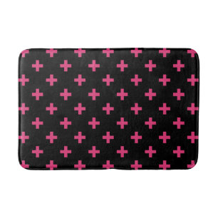 Fuchsia polka crosses on black bath mat