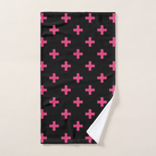 Fuchsia polka crosses on black hand towel