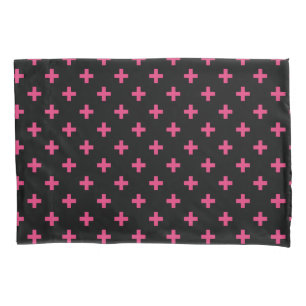 Fuchsia polka crosses on black pillowcase