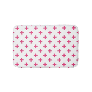 Fuchsia polka crosses on white bath mat