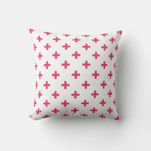 Fuchsia polka crosses on white cushion