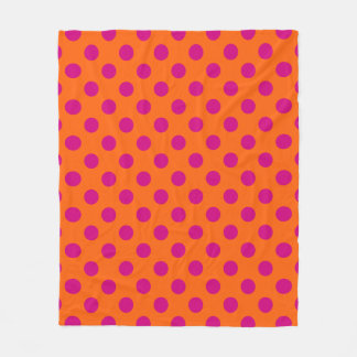 Fuchsia polka dots on orange fleece blanket