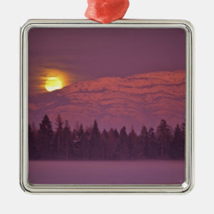 Full moon rises over Teakettle Mountain during Metal Tree Decoration