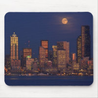 Full moon rising over downtown Seattle skyline