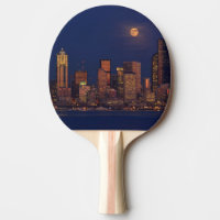 Full moon rising over downtown Seattle skyline