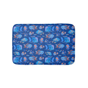 Fun tropical fishes on blue bath mat