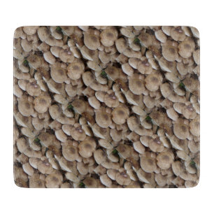 fun vegatable picture of fresh button mushrooms cutting board