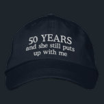 Funny 50th Anniversary Mens Hat Gift Cap<br><div class="desc">50th wedding anniversary gift for him says 50 years and she still puts up with me on an embroidered ball cap hat for the man married 50 years to the same wife.</div>