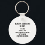 Funny Accountants - Being Accountant is Easy Key Ring<br><div class="desc">This funny and sarcastic design is perfect for sassy accountants. It features the statement " Being Accountant is easy. It's like riding a bike. Except the bike is on fire. You're on fire. Everything is on fire." It is perfect for CPAs (Certified Public Accountants),  bookkeepers,  and accounting officers.</div>