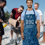 Funny BBQ is a Man's Kitchen Apron<br><div class="desc">Funny man apron featuring a blue geometric pattern background,  barbecue utensils,  plus the saying "a bbq is a man's kitchen".</div>