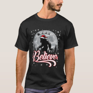 Funny Believe Christmas Bigfoot Santa Hat Moon Sce T-Shirt