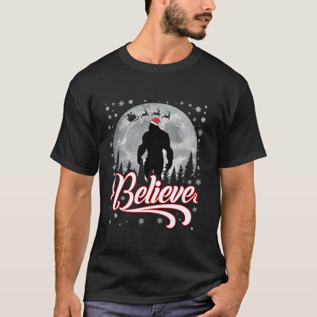 Funny Believe Christmas Bigfoot Santa Hat Moon Sce T-Shirt (Front)