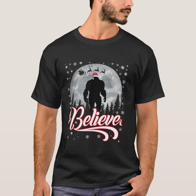 Funny Believe Christmas Bigfoot Santa Hat Moon Sce T-Shirt (Front)