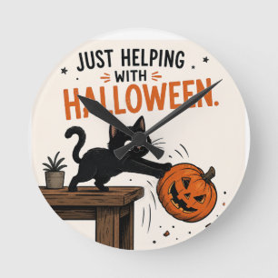 Funny Black Cat Knocking Over Pumpkin Halloween Round Clock