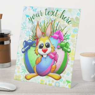 Funny Bunny biting an Easter Egg Pedestal Sign