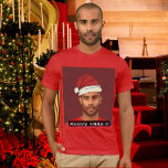 Funny custom Xmas. Santa's hat photo T-Shirt<br><div class="desc">Design Help: https://www.zazzle.com/live/categories/design help Photo, banner, text, Santa's hat and Xmas. snow crystals. Upload your own picture, edit photo, and hat filters and text ( message, font, size, colour). Funny fully personalised Christmas tee. You can easily move, rotate, replace, duplicate, delete, flip, scale ... all the elements. Choose t-shirt style,...</div>