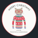 Funny Cute Cat Wearing Ugly Christmas Sweater Classic Round Sticker<br><div class="desc">Funny winter holiday Christmas sticker featuring a cat wearing red glasses and an "Ugly" Christmas Nordic Sweater. Actually, we think he's rather cute! Add your custom text above or leave Merry Christmas . . . add your name below. Makes the perfect Christmas sticker for gifts and cards for cat lovers....</div>