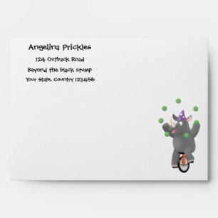 Funny cute rhino juggling on unicycle envelope