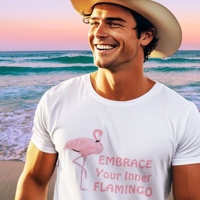 Funny Embrace Your Inner Flamingo Quote T-Shirt (handsome fit young male model wearing pink flamingo t-shirt at beach)