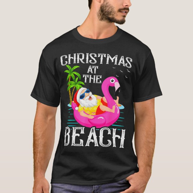 Funny Flamingo Float Santa Claus Christmas At The  T-Shirt (Front)