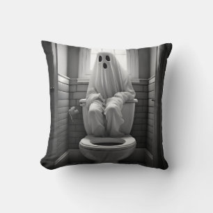 Funny ghost sitting in toilet cushion