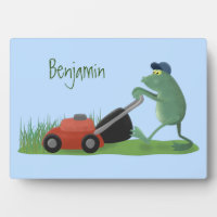 Funny green frog mowing lawn cartoon