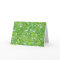 Funny green frogs entangled in a messy pattern