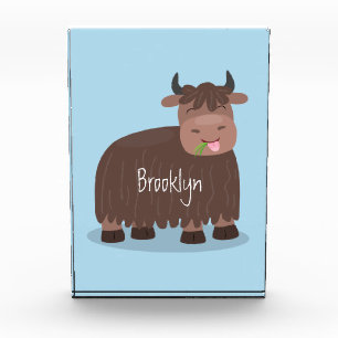 Funny happy yak eating grass cartoon illustration photo block