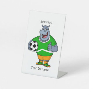 Funny hippo soccer player cartoon illustration  pedestal sign