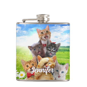 Funny kittens in green field. hip flask