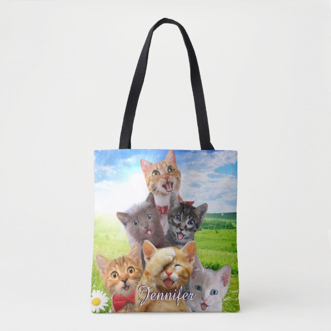 Funny kittens in green field.                      tote bag (Front)