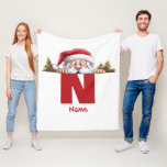 Funny Monogram Family Christmas Custom Red Santa Fleece Blanket<br><div class="desc">Elevate your family's Christmas celebrations with our Funny Monogram Family Christmas Custom Red Santa Fleece Blanket. This personalised fleece blanket is a perfect addition to your holiday decor and can also make a great gift for family members. Customise this blanket with your family's names to create a unique keepsake that's...</div>