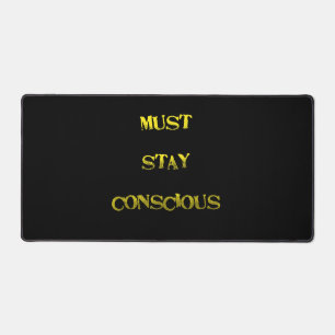 Funny "Must Stay Conscious" Reminder Desk Mat