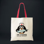 Funny nursing tote bag with cute penguin nurse<br><div class="desc">Funny nursing tote bag with cute penguin nurse. Animal cartoon with big syringe needle. Personalizable text and colours. Cute quote gift idea for nursing school graduate,  RN nurse,  Registered nurse,  caregiver,  lpn,  nurse week,  nurse day etc.</div>