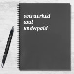 Funny Overworked and Underpaid Work Quote Notebook<br><div class="desc">A funny,  humourous (and probably true!) notebook with a dark grey background and modern,  bold white typography that reads "Overworked and underpaid". A little subtle hint for your workplace perhaps?</div>
