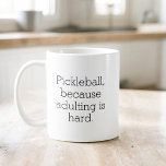 Funny Pickleball Typography Simple Minimalist Coffee Mug<br><div class="desc">Enjoy your coffee with a touch of humour with the Funny Pickleball Typography Simple Minimalist Coffee Mug. This stylish mug features a clean, minimalist design with witty pickleball sayings that bring a smile to your face. Made from high-quality ceramic, it’s perfect for your morning brew or afternoon tea. Its comfortable...</div>