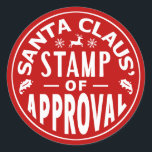 Funny Santa Claus Christmas Stamp of Approval Classic Round Sticker<br><div class="desc">These humourous Christmas stickers are done in red and white and made to look like they've been stamped by Santa. They read, "Santa Claus' Stamp of Approval" and show silhouettes of mistletoe, a reindeer and snowflakes. These stickers would look cute on envelopes, wrapped gift boxes or anywhere else you want...</div>