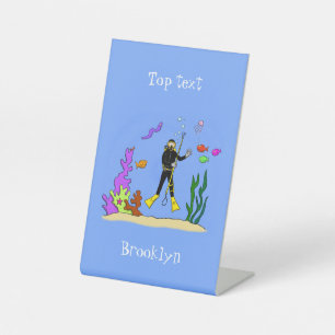 Funny scuba diver and fish sea creatures cartoon pedestal sign